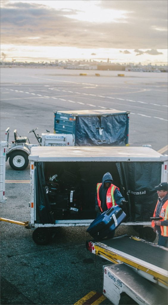 luggage-crew-565x1024 Baggage handling crew at an airport
